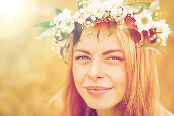 Image showing happy woman in wreath of flowers