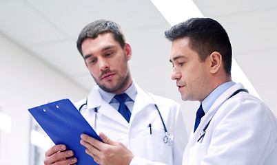 Image showing two doctors at hospital with clipboard