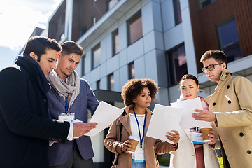 Image showing international business team with papers in city