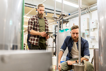 Image showing men with tablet pc at craft beer brewery filter