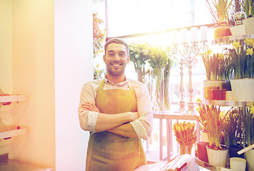 Image showing florist man or seller at flower shop counter