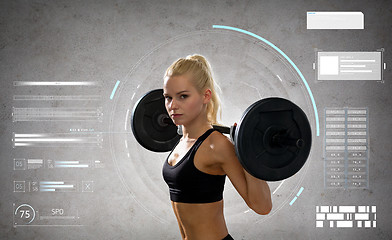 Image showing young sporty woman exercising with barbell