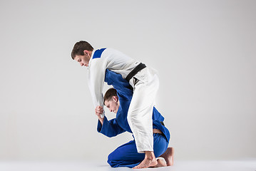 Image showing The two judokas fighters fighting men