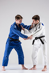 Image showing The two judokas fighters fighting men