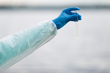 Image showing Photo of hand with test-tube