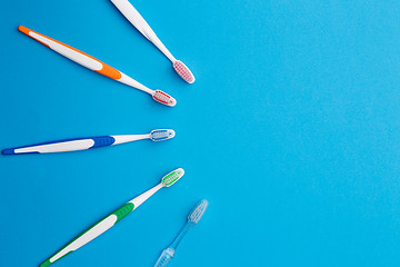 Image showing Colorful toothbrushes place for inscription