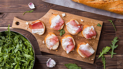 Image showing Bread , bacon on cutting board