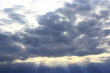 Image showing dark evening clouds and beams of sun