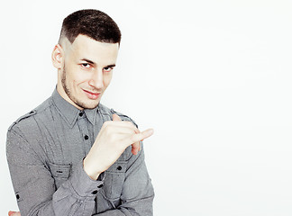 Image showing Portrait of a smart serious young man standing against white background. Emotional concept for gesture 