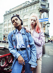 Image showing Two teenage girls infront of university building smiling, having fun, lifestyle real people concept 