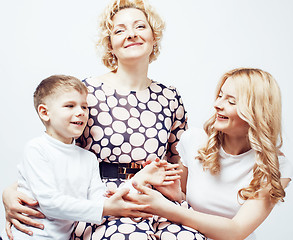 Image showing happy smiling family together posing cheerful on white background, lifestyle people concept, mother with son and teenage daughter isolated 