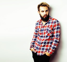 Image showing young handsome hipster bearded guy looking brutal isolated on white background, lifestyle people concept