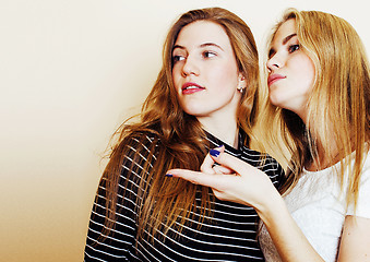 Image showing best friends teenage girls together having fun, posing emotional on white background, besties happy smiling, lifestyle people concept