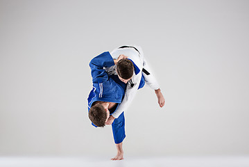 Image showing The two judokas fighters fighting men