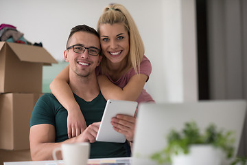 Image showing Young couple moving in a new home