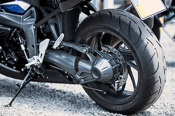 Image showing Motorcycle luxury items close-up: headlights, shock absorber, wheel, wing, toning.