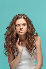 Image showing Portrait of young woman with shocked facial expression