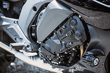 Image showing Motorcycle luxury items close-up: headlights, shock absorber, wheel, wing, toning.