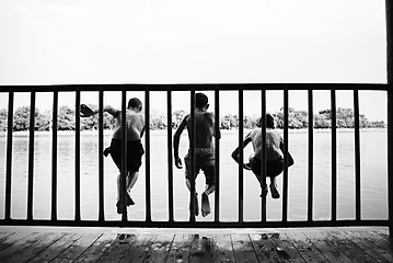 Image showing Children jumping from waterfront