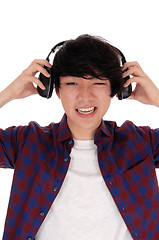 Image showing Asian man listen to music.