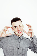 Image showing Portrait of a smart serious young man standing against white background. Emotional concept for gesture 