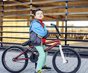 Image showing young kid on cool bmx bicycle riding outside, lifestyle people concept 