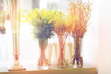 Image showing close up of flowers in vases at flower shop