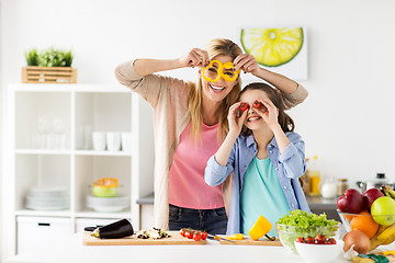 Image showing happy family cooking dinner at home kitchen