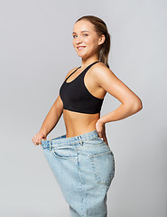 Image showing young slim sporty woman in oversize pants