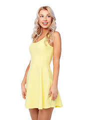 Image showing happy smiling beautiful young woman in dress