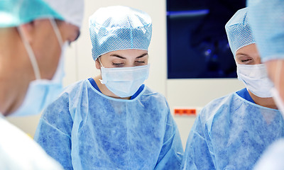 Image showing group of surgeons in operating room at hospital