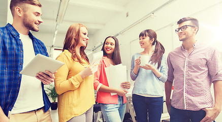 Image showing creative team on coffee break talking at office