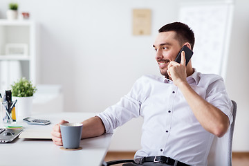 Image showing businessman calling on smartphone at office