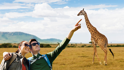 Image showing happy couple with backpacks traveling in africa