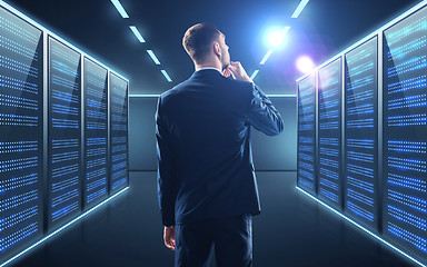 Image showing businessman over server room background