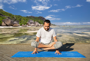 Image showing man making yoga in scale pose outdoors