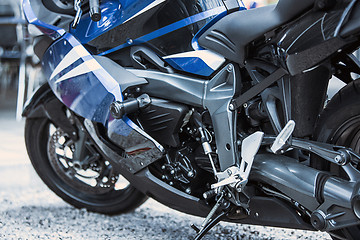 Image showing Motorcycle luxury items close-up: headlights, shock absorber, wheel, wing, toning.