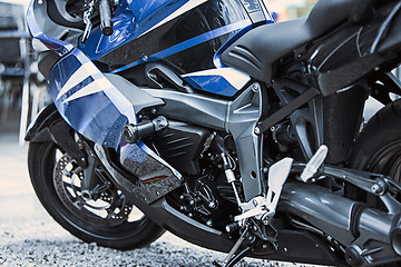 Image showing Motorcycle luxury items close-up: headlights, shock absorber, wheel, wing, toning.