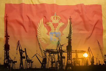 Image showing Industrial concept with Montenegro flag at sunset