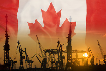 Image showing Industrial concept with Canada flag at sunset