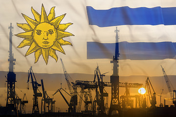 Image showing Industrial concept with Uruguay flag at sunset