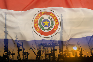 Image showing Industrial concept with Paraguay flag at sunset