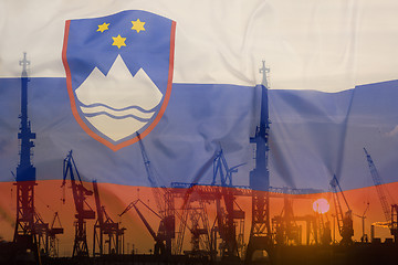 Image showing Industrial concept with Slovenia flag at sunset
