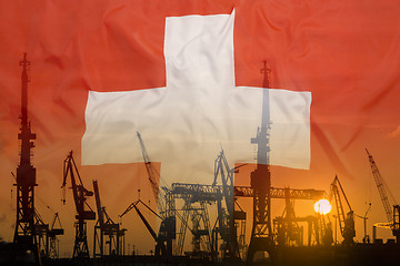 Image showing Industrial concept with Switzerland flag at sunset