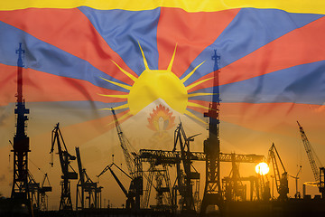 Image showing Industrial concept with Tibet flag at sunset