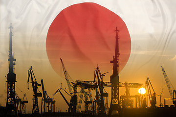 Image showing Industrial concept with Japan flag at sunset