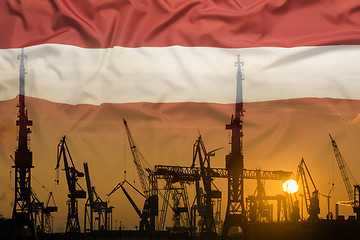 Image showing Industrial concept with Latvia flag at sunset