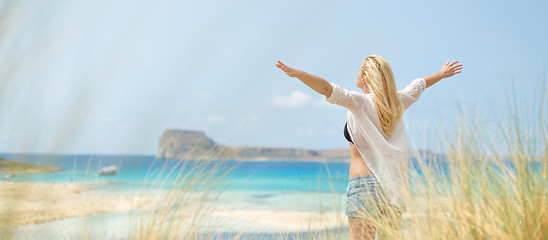 Image showing Free Happy Woman Enjoying Sun on Vacations.