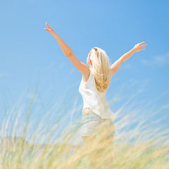 Image showing Free Happy Woman Enjoying Sun on Vacations.