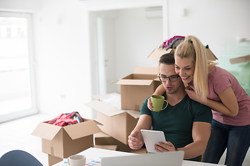 Image showing Young couple moving in a new home